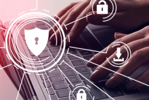 person typing on laptop computer overlayed with security icons
