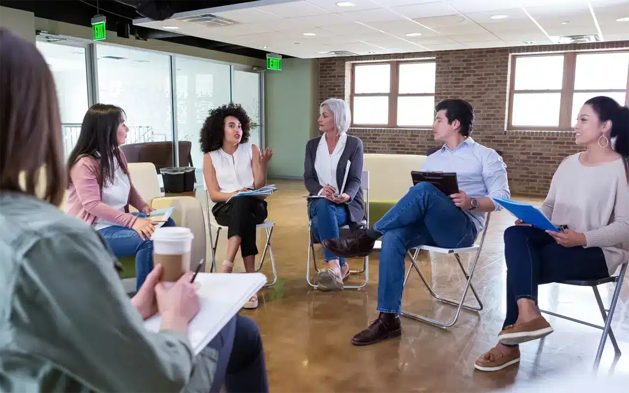 a group of people in a meeting